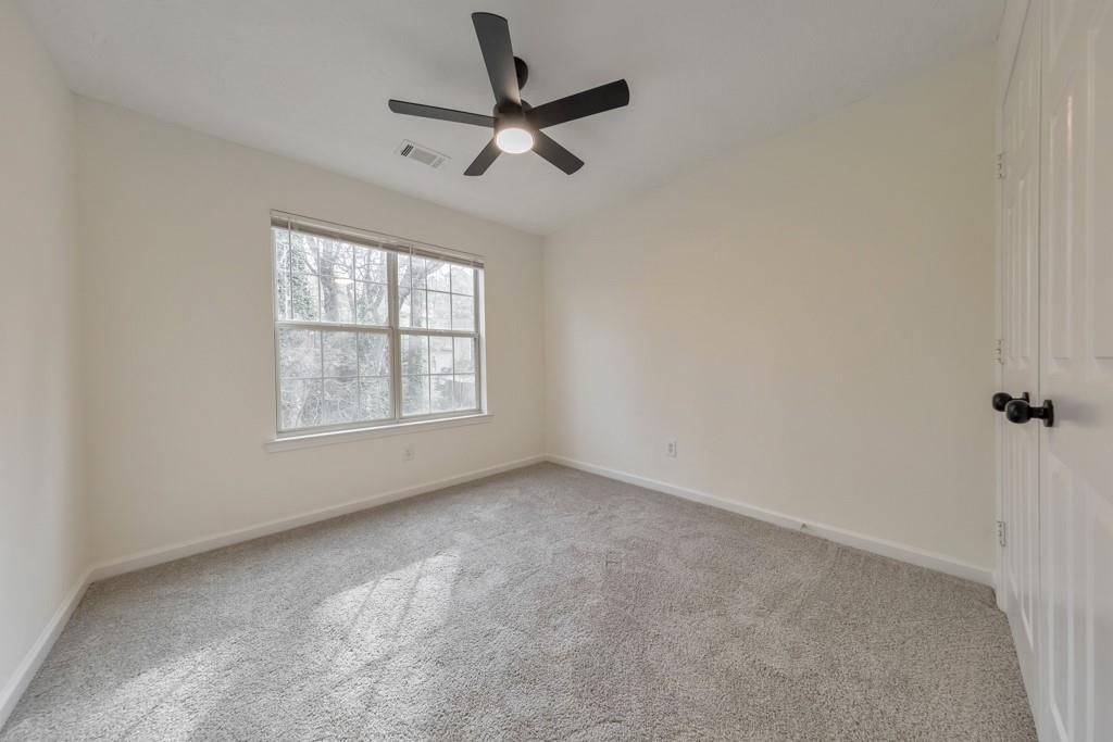 334 Fallview Drive McDonough, GA 30253 - Photo 25 of 34 an empty room with ceiling fan and windows