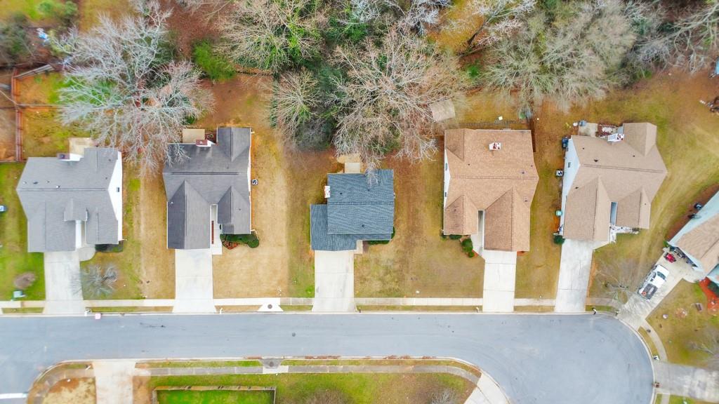 334 Fallview Drive McDonough, GA 30253 - Photo 32 of 34 aerial view of a bedroom with a bed and dresser