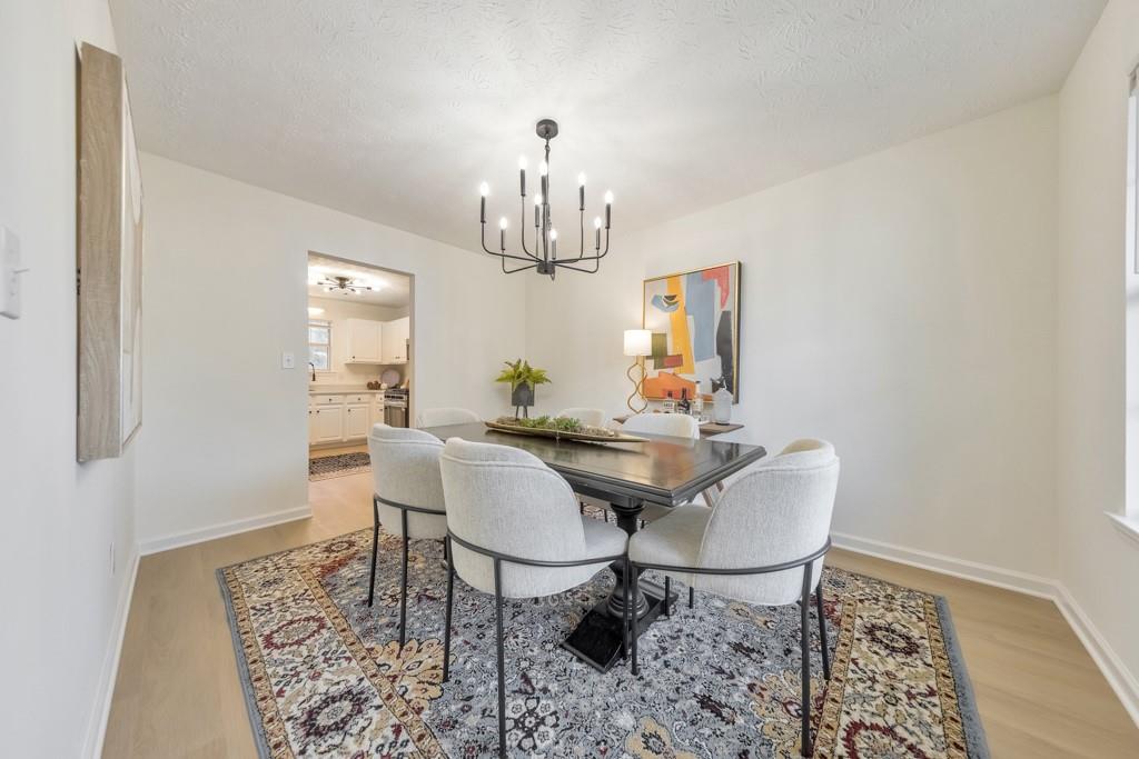334 Fallview Drive McDonough, GA 30253 - Photo 10 of 34 a view of a dining room with furniture and chandelier