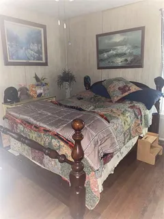 a view of a hallway with entryway and front door