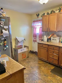 a bed sitting in a room next to a window