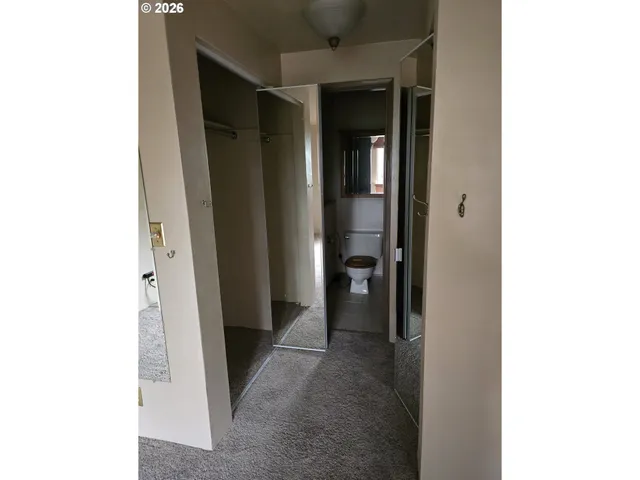 a view of a hallway with closet