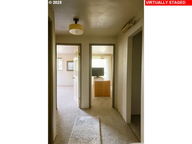 a view of a bathroom from a hallway
