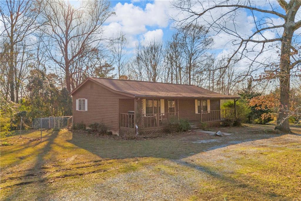 1019 White Hill School Road Commerce, GA 30529 - Photo 16 of 53 a front view of a house with a yard covered in snow