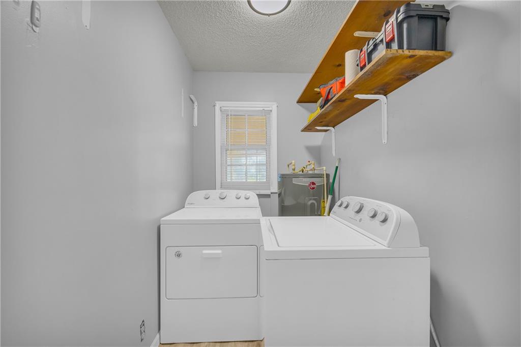 1019 White Hill School Road Commerce, GA 30529 - Photo 35 of 53 a utility room with dryer and washer