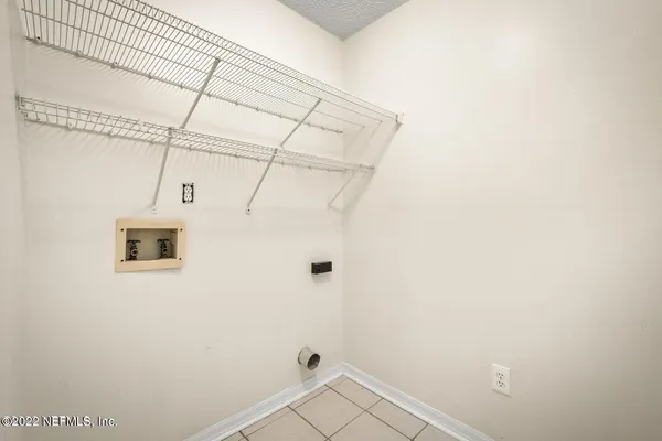 a bathroom with a double vanity sink mirror and bathtub