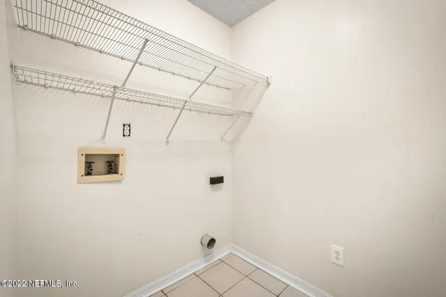 a bathroom with a double vanity sink mirror and bathtub