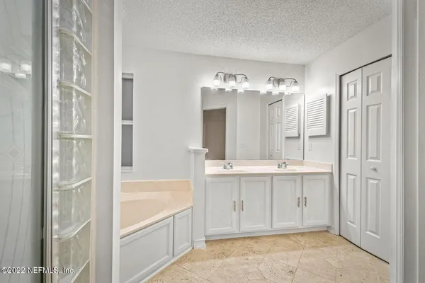 a view of bathroom with dual sinks