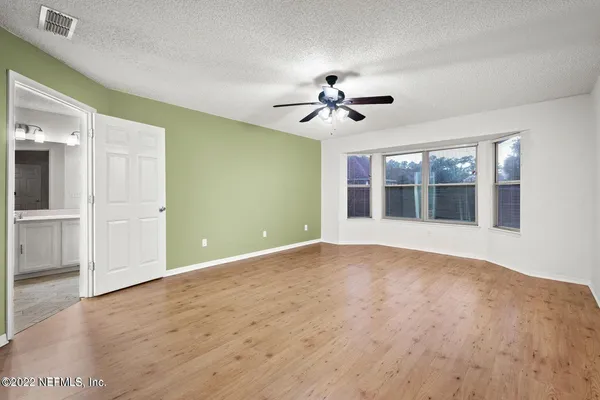 a front view of house with yard and outdoor seating