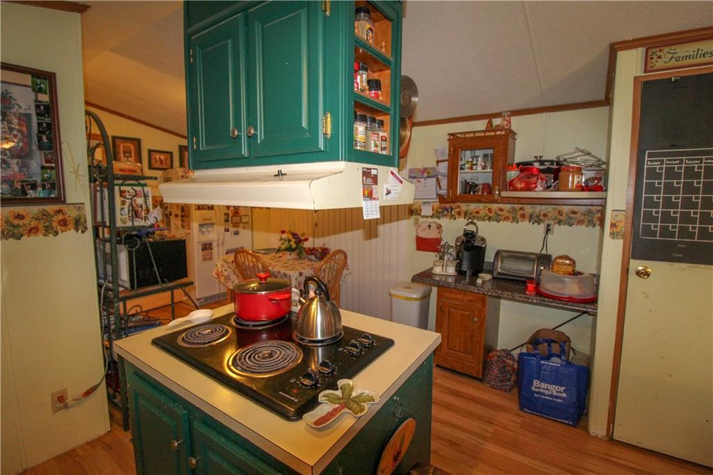 260 Hammett Road Enfield, ME 04493 - Photo 11 of 35 Kitchen island with cooktop and...
