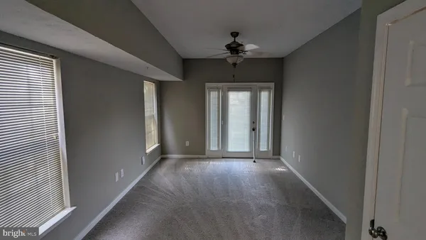 a view of a hallway with a chandelier