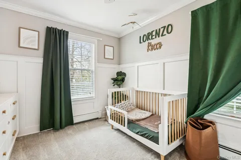 a bedroom with furniture and a window