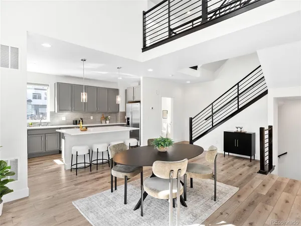 a kitchen with a table and chairs in it