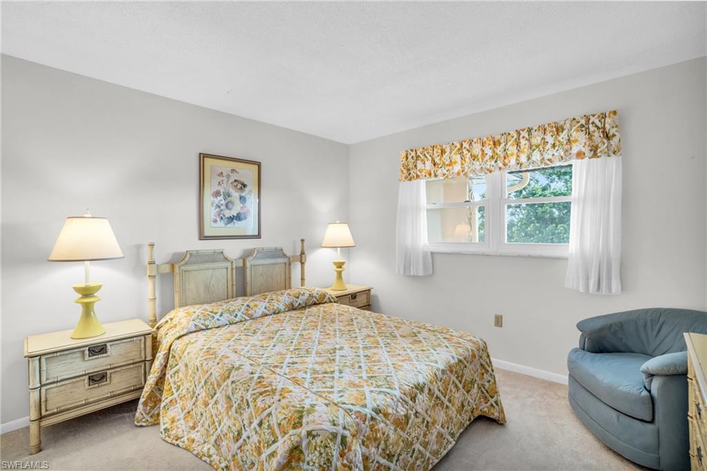 5419 Rattlesnake Hamm Road, Unit 304F Naples, FL 34113 - Photo 10 of 15 GUEST BEDROOM SUITE WITH POCKET DOOR AND NEWER IMPACT WINDOW..