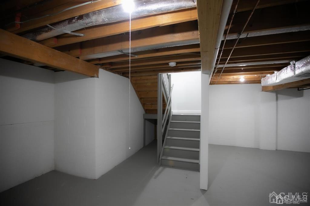 4208 Hana Road Edison, NJ 08817 - Photo 27 of 34 a view of walk in closet with empty racks