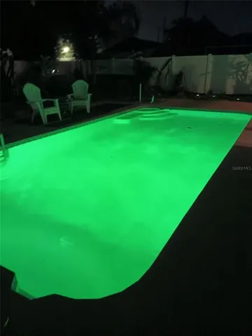 a kitchen with granite countertop a sink and a stove