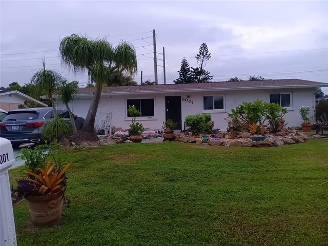 a backyard of a house with lots of green space