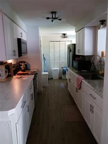 a view of swimming pool with a table and chairs
