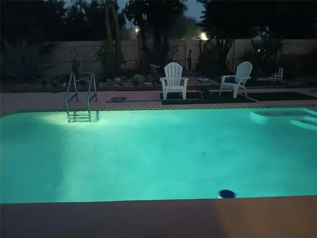 a backyard of a house with barbeque oven