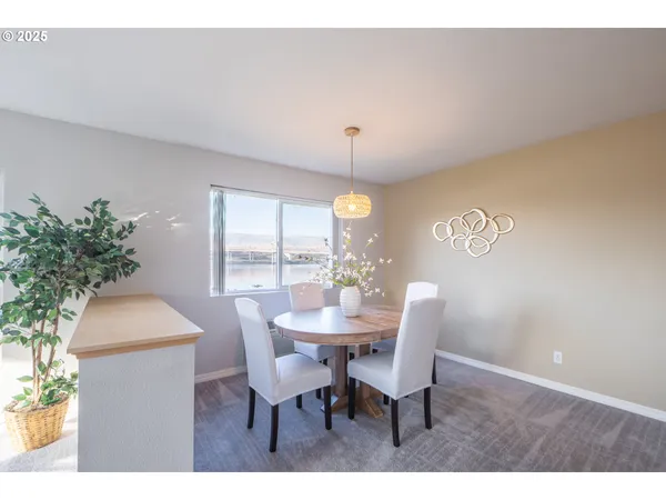 a dining room with furniture and window