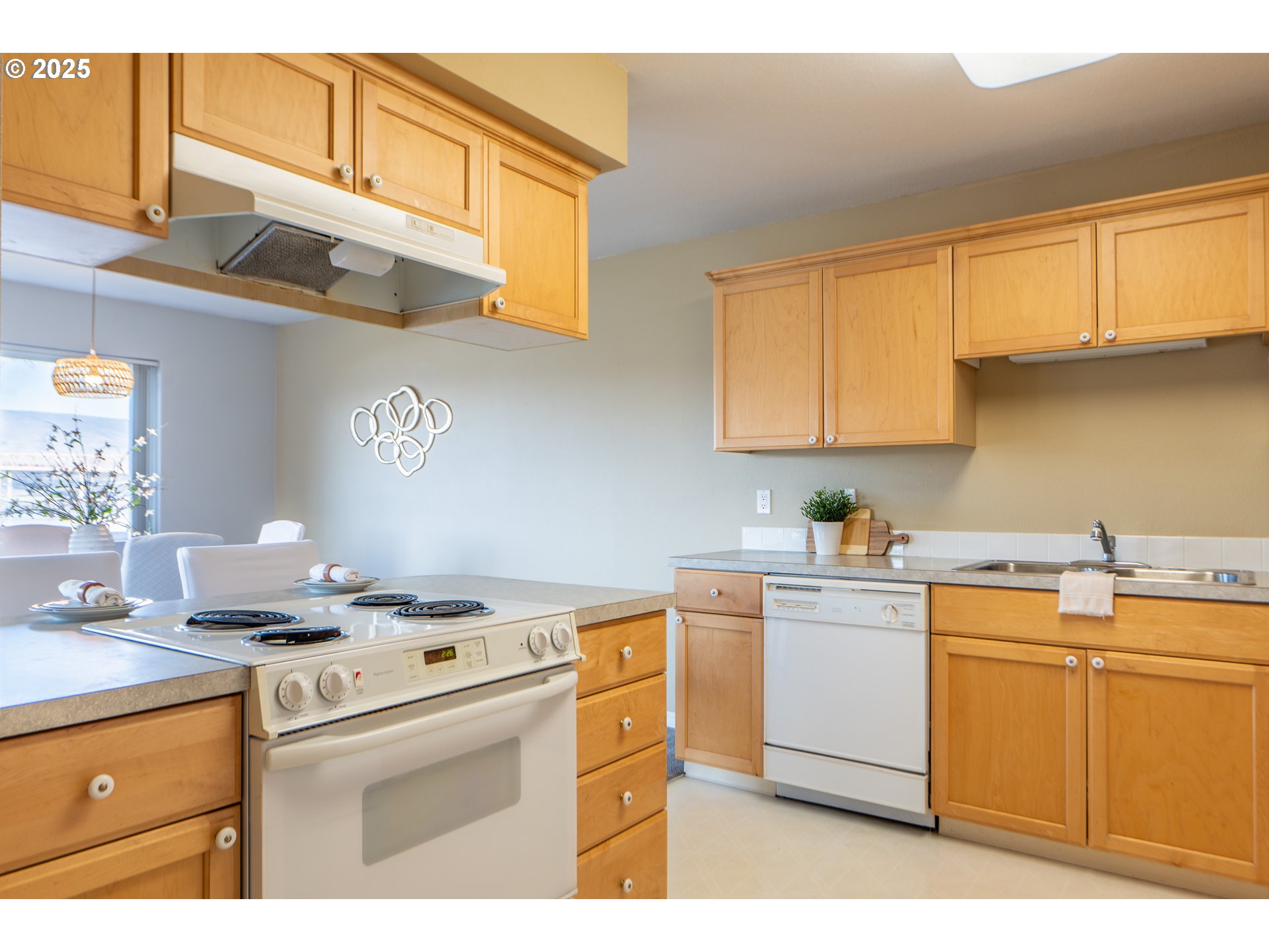 240 Lone Pine Lane, Unit 2 The Dalles, OR 97058 - Photo 20 of 37 a kitchen with a sink cabinets and appliances