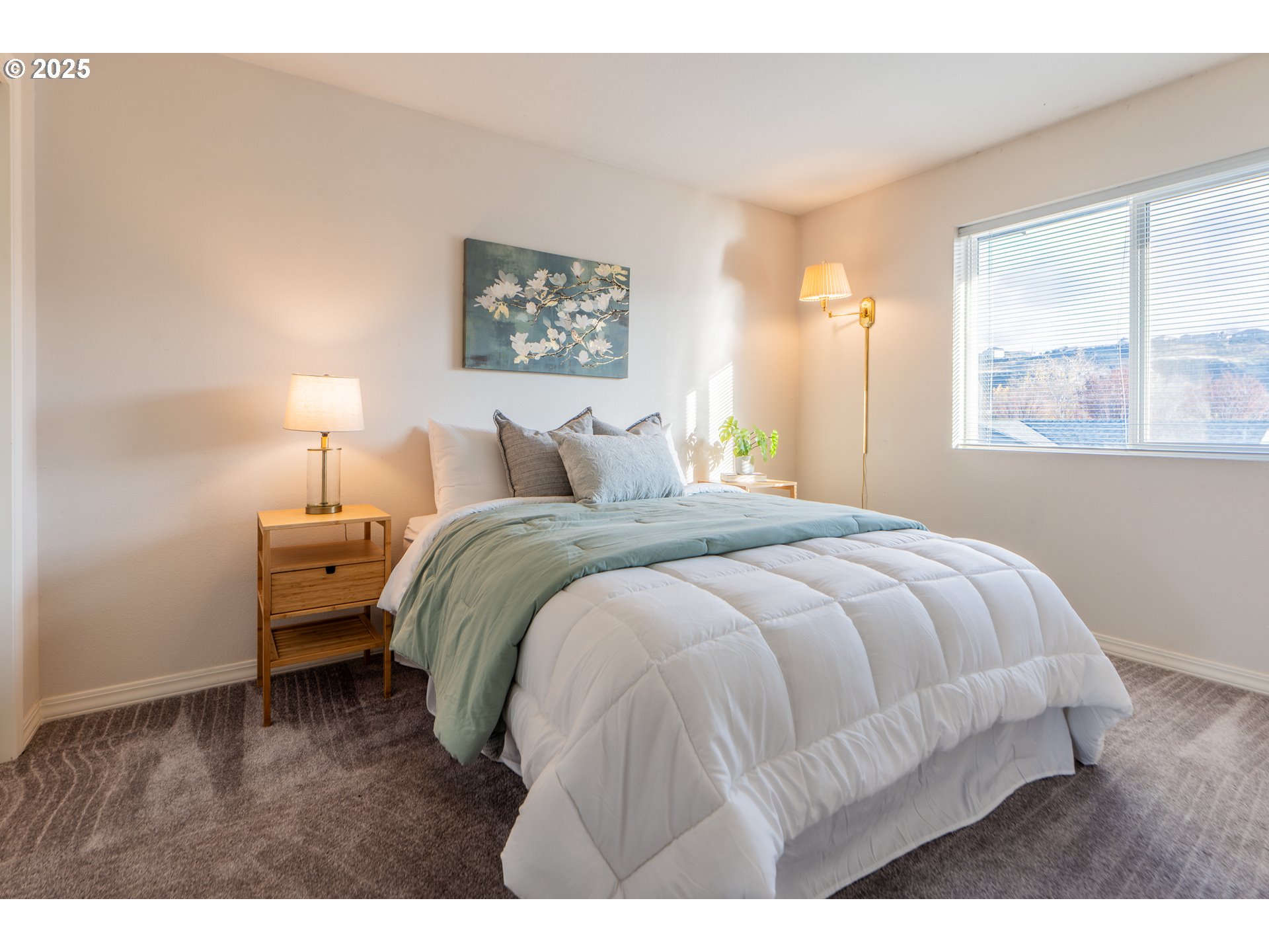 240 Lone Pine Lane, Unit 2 The Dalles, OR 97058 - Photo 28 of 37 a bedroom with a bed and a window
