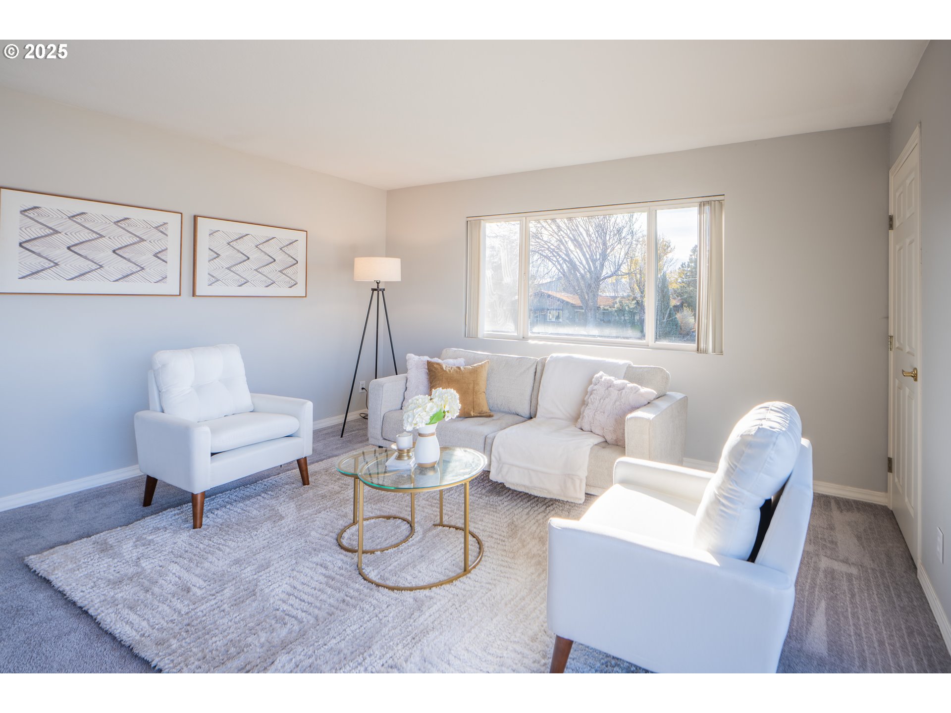 240 Lone Pine Lane, Unit 2 The Dalles, OR 97058 - Photo 8 of 37 a living room with furniture a large window and a table
