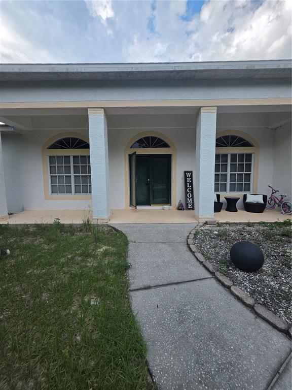 17820 Monteverde Drive Spring Hill, FL 34610 - Photo 1 of 42 a view of a house with a yard