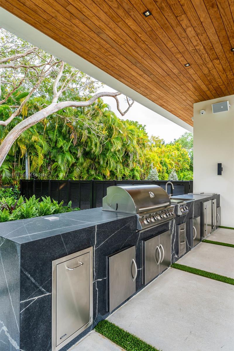 7825 Southwest 128th Street Pinecrest, FL 33156 - Photo 53 of 88 a view of a chairs and table in the patio