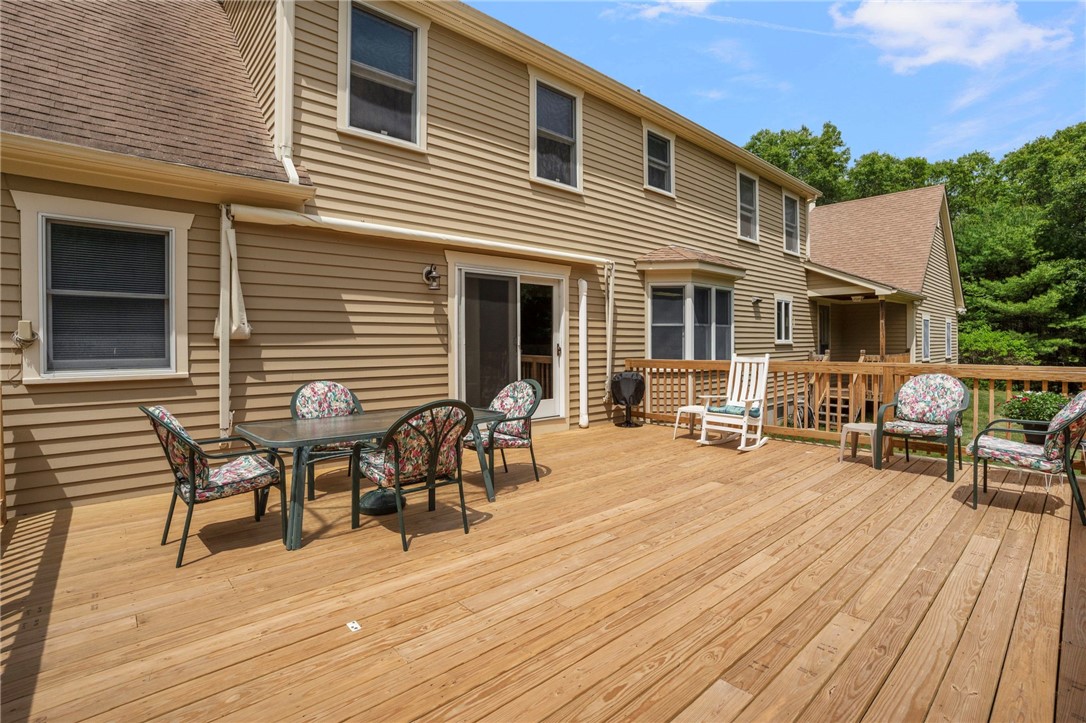 310 Plain Road West Greenwich, RI 02817 - Photo 35 of 39 New wood deck as of Spring 2026 with a built-in awning