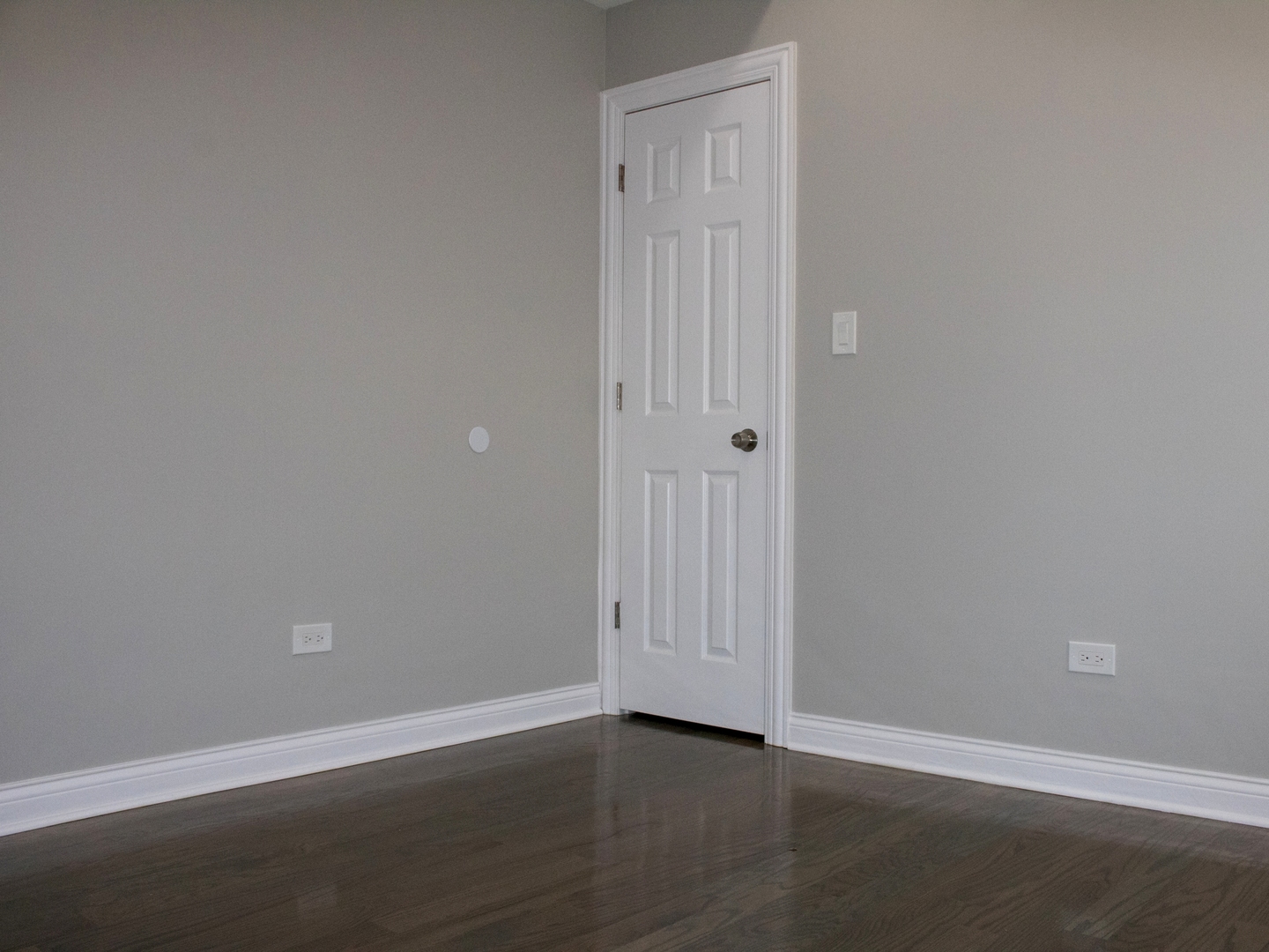 3257 West Warren Boulevard, Unit 2 Chicago, IL 60624 - Photo 8 of 10 a view of an empty room with wooden floor