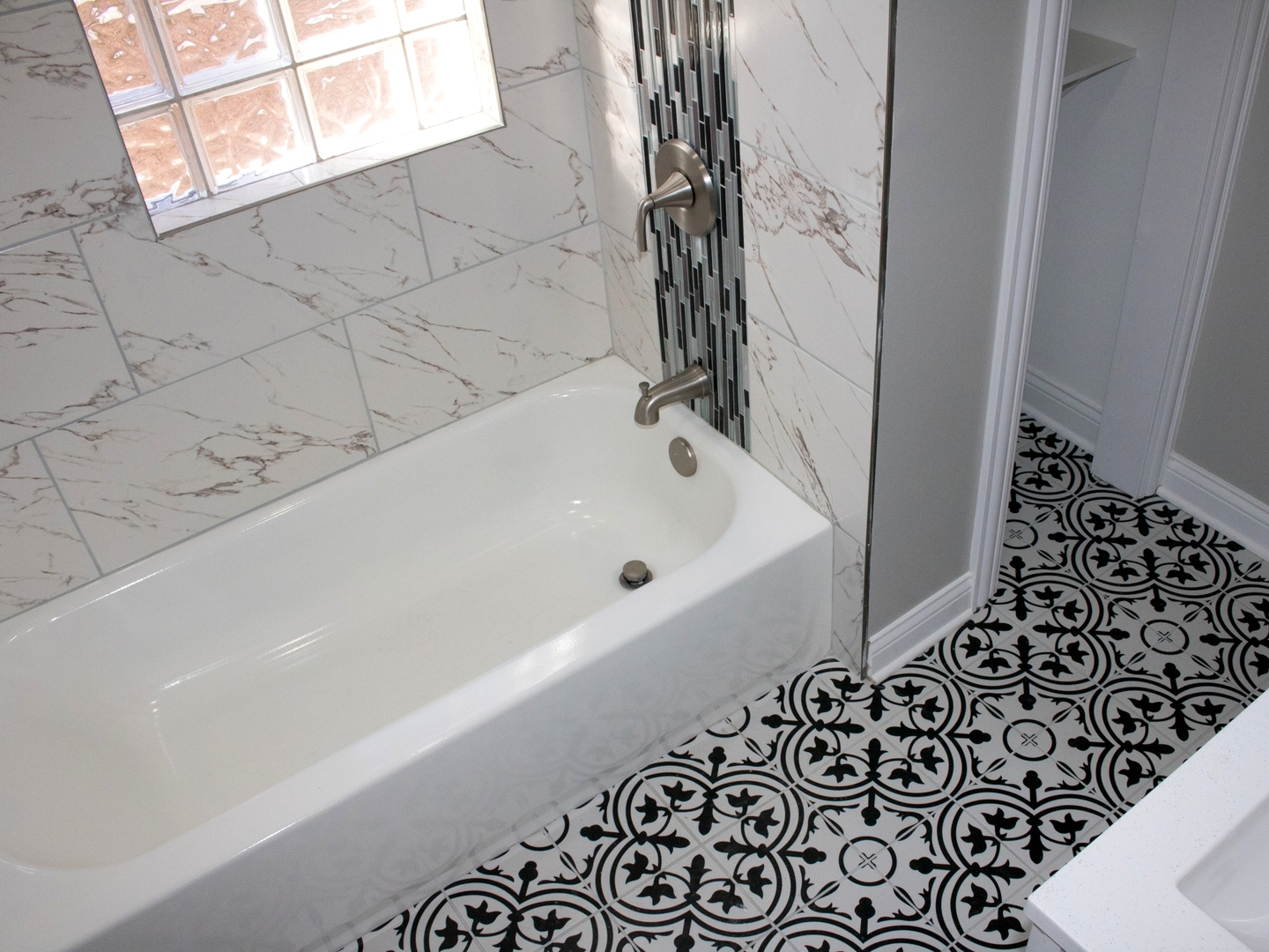 3257 West Warren Boulevard, Unit 2 Chicago, IL 60624 - Photo 9 of 10 a bathroom with a bathtub and shower