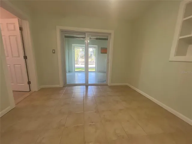 a view of an empty room with a fan