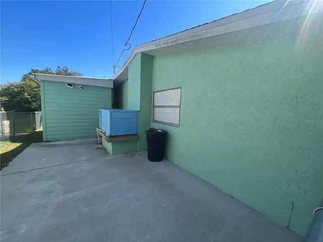 a view of backyard and deck