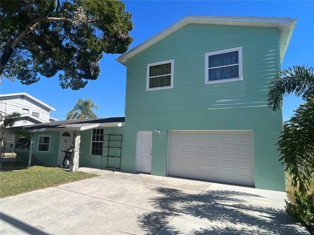 a house with a tree in front of it