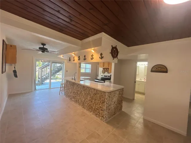a view of living room and kitchen with furniture