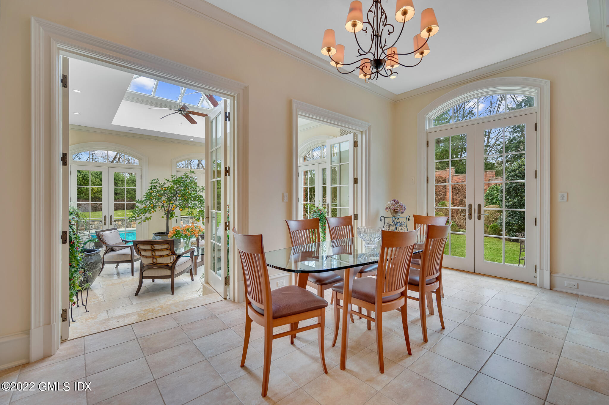 19 French Road Greenwich, CT 06831 - Photo 12 of 32 a dining room with furniture a chandelier and a rug