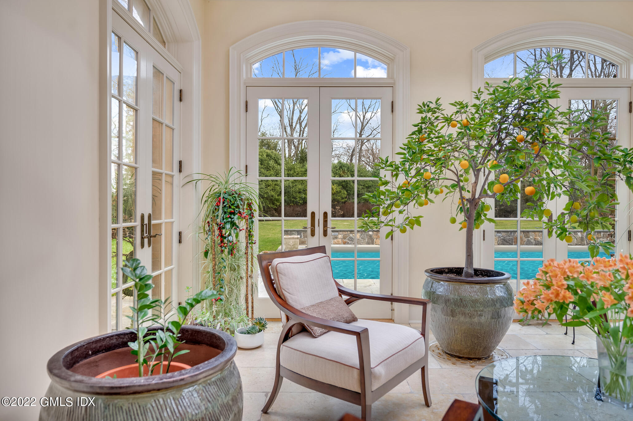 19 French Road Greenwich, CT 06831 - Photo 13 of 32 a dining room with furniture and a potted plant