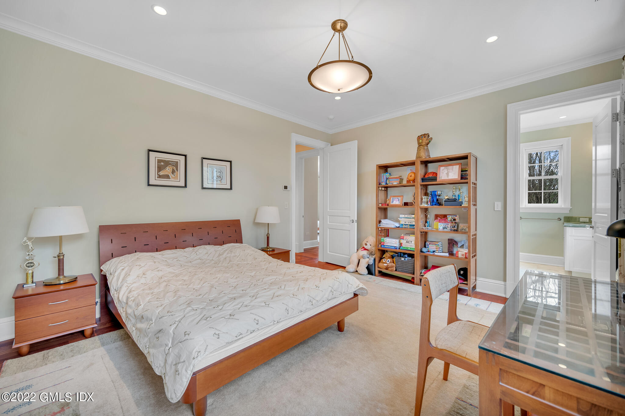 19 French Road Greenwich, CT 06831 - Photo 20 of 32 a bedroom with a bed a dresser and book shelf