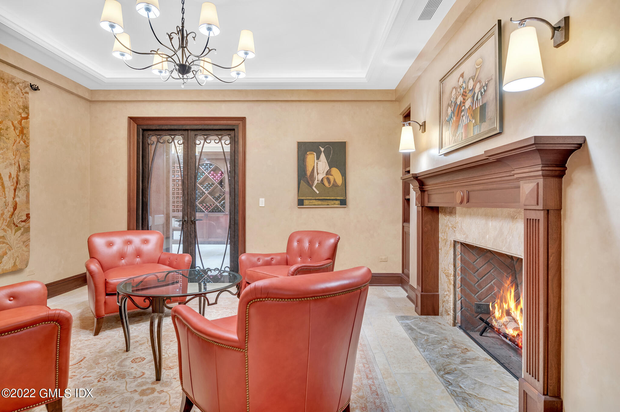19 French Road Greenwich, CT 06831 - Photo 29 of 32 a living room with furniture a chandelier and a fireplace