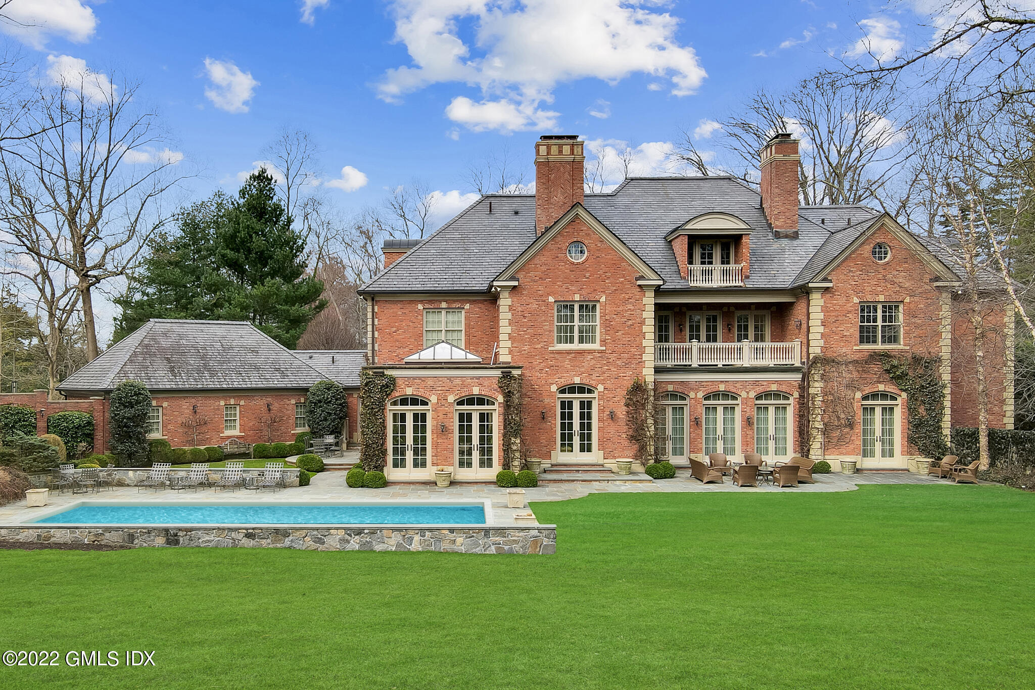19 French Road Greenwich, CT 06831 - Photo 31 of 32 a front view of a house with a yard