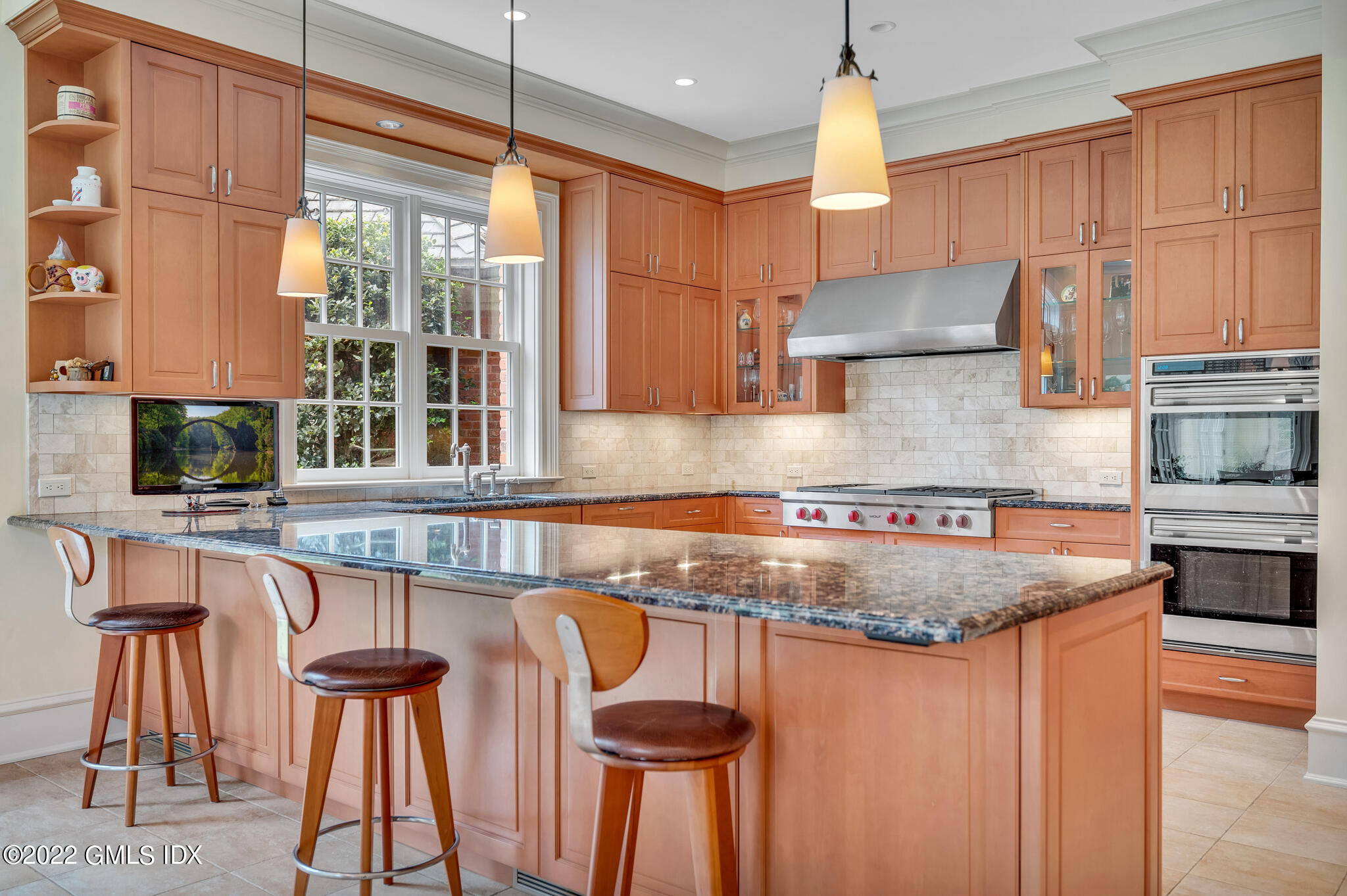 19 French Road Greenwich, CT 06831 - Photo 10 of 32 a kitchen with stainless steel appliances granite countertop a sink and a refrigerator