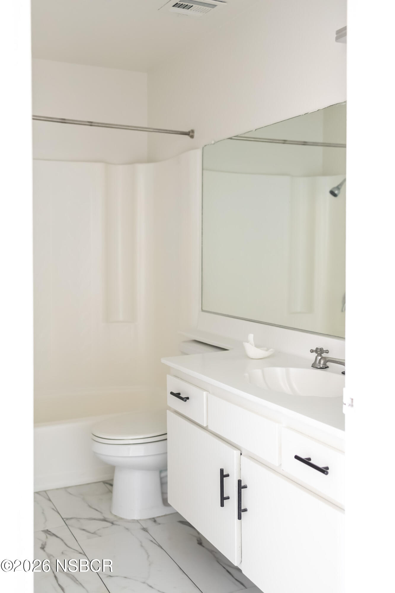 829 Jones Street, Unit 4 Santa Maria, CA 93454 - Photo 12 of 15 a bathroom with a sink a toilet and a mirror