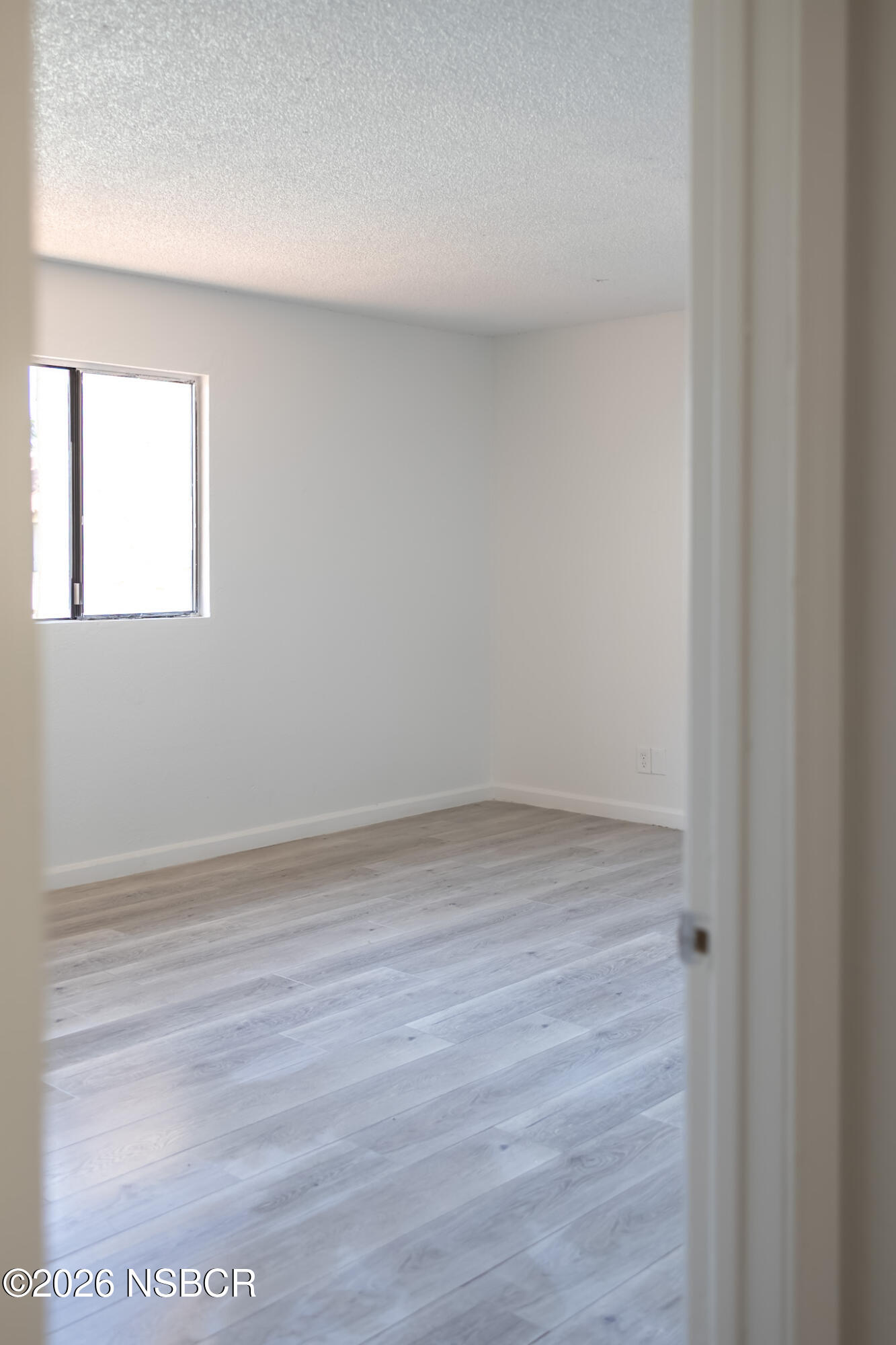 829 Jones Street, Unit 4 Santa Maria, CA 93454 - Photo 14 of 15 a view of a small space with wooden floor and a window