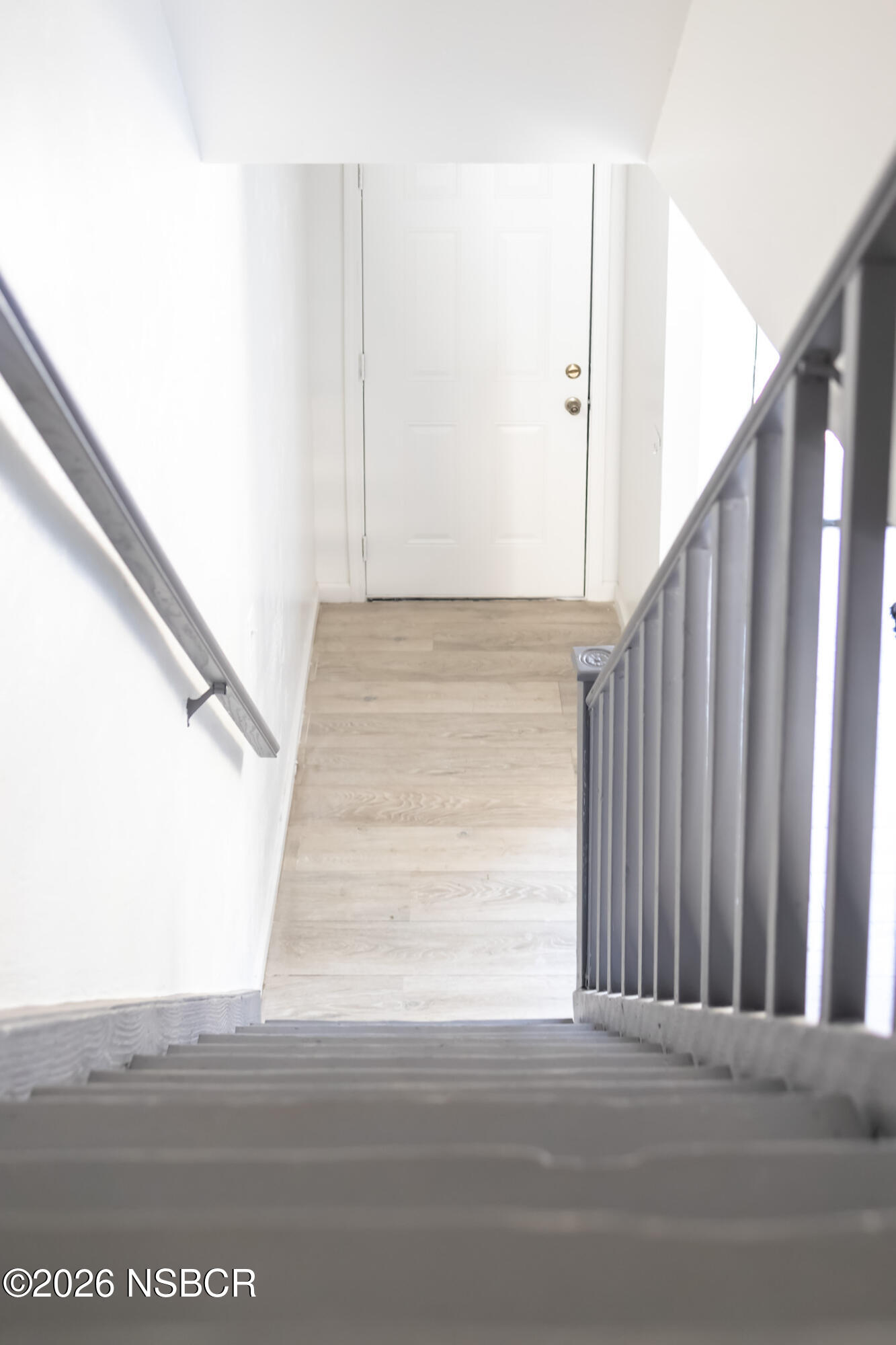 829 Jones Street, Unit 4 Santa Maria, CA 93454 - Photo 6 of 15 a view of staircase with white walls and railing