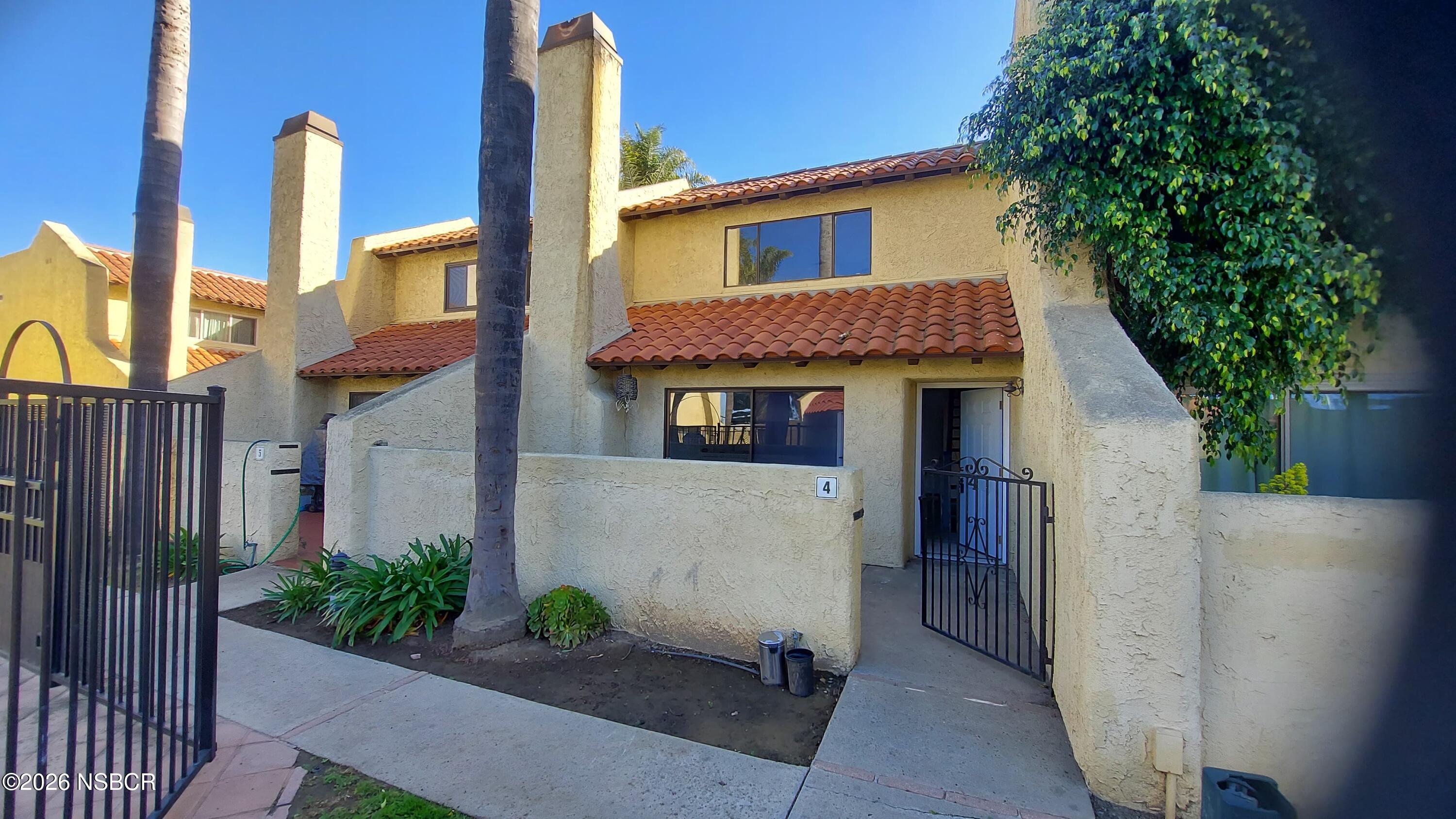 829 Jones Street, Unit 4 Santa Maria, CA 93454 - Photo 7 of 15 a view of a house with a yard