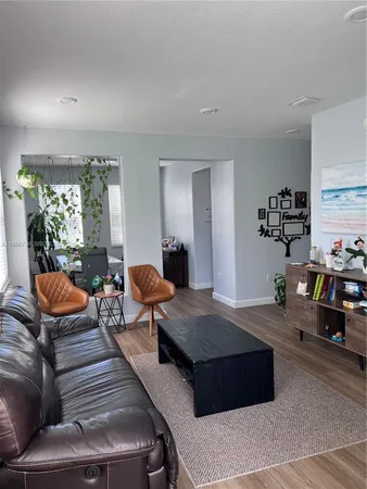 a living room with furniture and a table