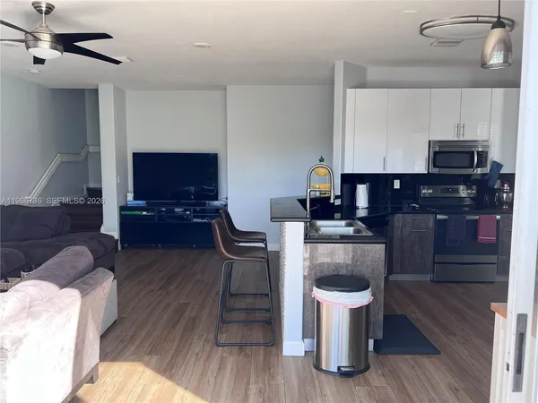 a kitchen with a stove and a refrigerator