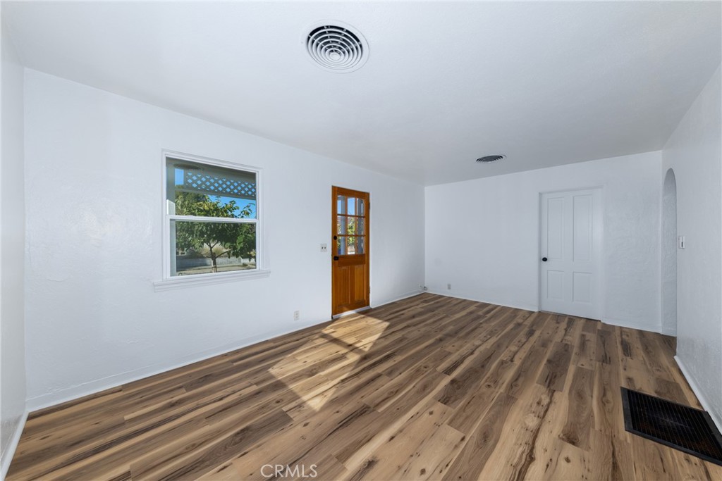 1208 Ohio Street Redlands, CA 92374 - Photo 3 of 14 a view of empty room with window and wooden floor
