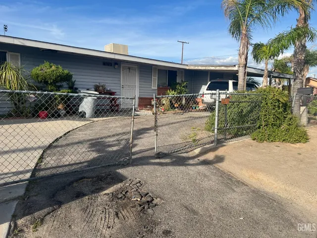 a view of a backyard with potted plants